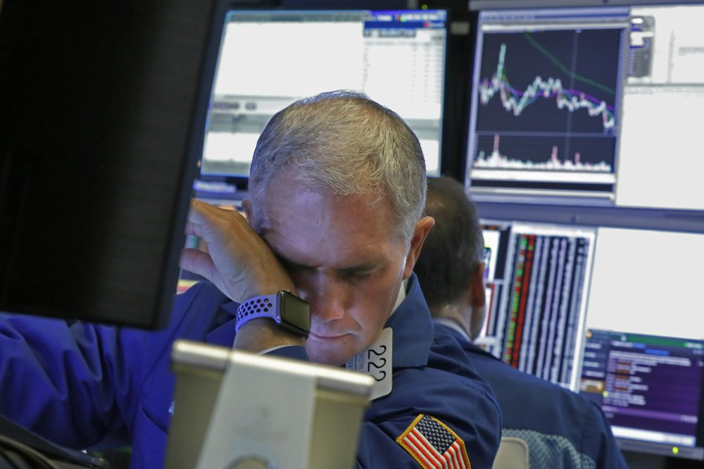 Specialist Timothy Nick works on the floor of the New York Stock Exchange, Monday, March 9, 2020.