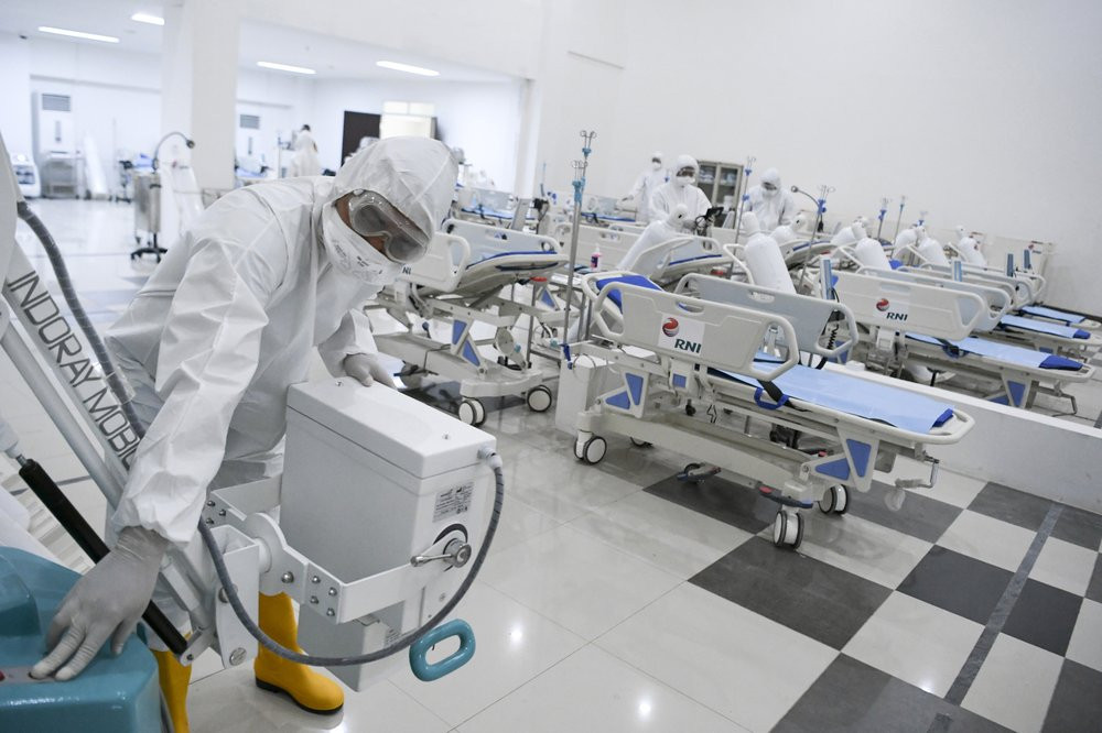 Staff inspect medical equipments at an emergency hospital set up amid the new coronavirus outbreak in Jakarta, Indonesia, Monday, March 23, 2020.