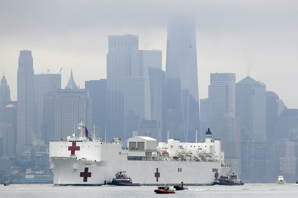 The Navy hospital ship USNS Comfort passes lower Manhattan on its way to docking in New York, Monday, March 30, 2020. The ship has 1,000 beds and 12 operating rooms.