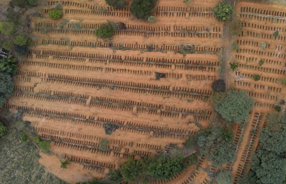 Newly dug, empty graves fill the Sao Luiz cemetery where COVID-19 victims will be buried in Sao Paulo, Brazil, Thursday, June 4, 2020.