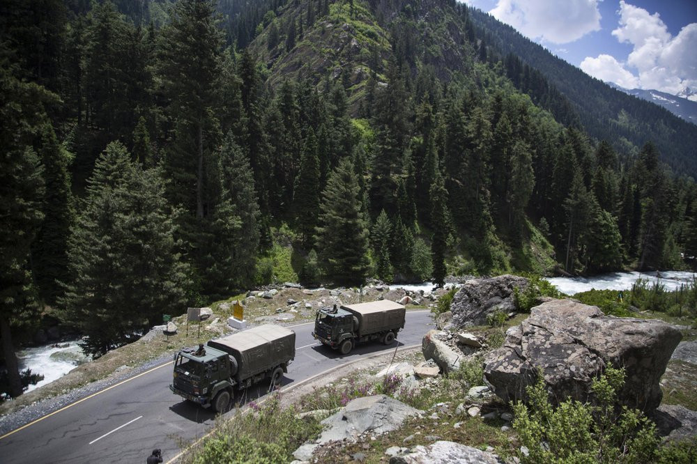 In this Tuesday, Sept. 1, 2020, file photo, an Indian army convoy moves on the Srinagar- Ladakh highway at Gagangeer, northeast of Srinagar, Indian-controlled Kashmir.