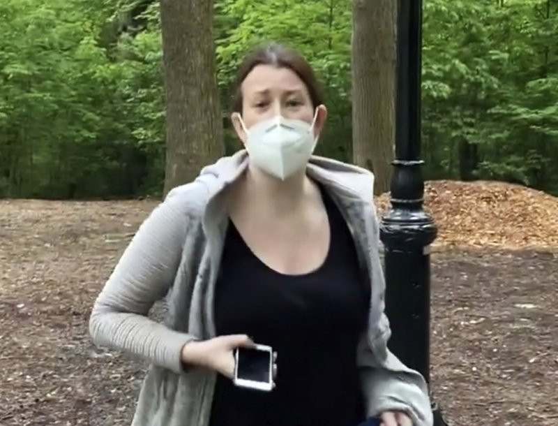 This file image made from May 25, 2020 video provided by Christian Cooper, shows Amy Cooper with her dog talking to Christian Cooper in Central Park in New York.