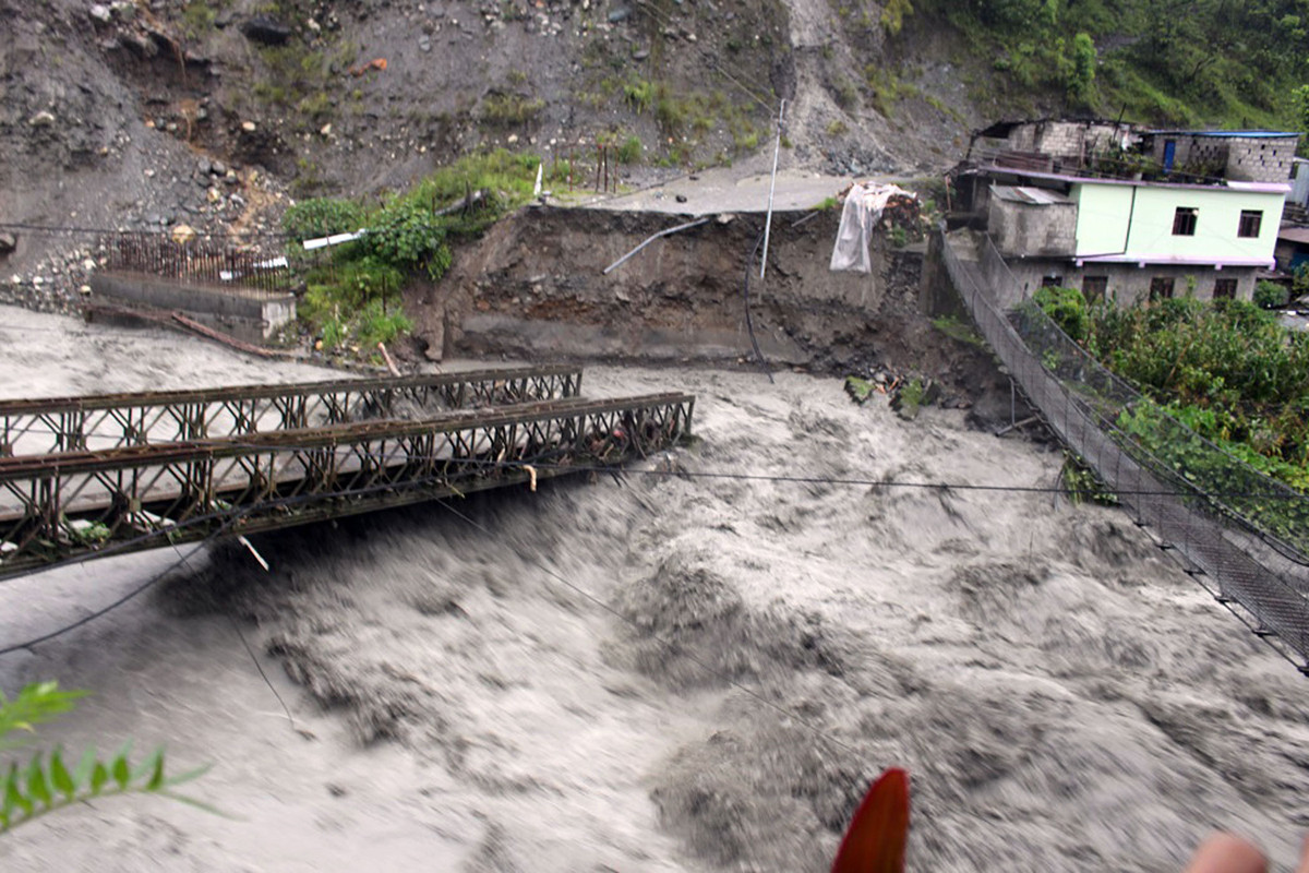 The bridge over Raghuganga river at the border of Galeshwore in Beni municipality 9 and Rahughat of Raghuganga rural municipality 3 in Myagdi destroyed by floods. Photo: Santosh Gautam/RSS