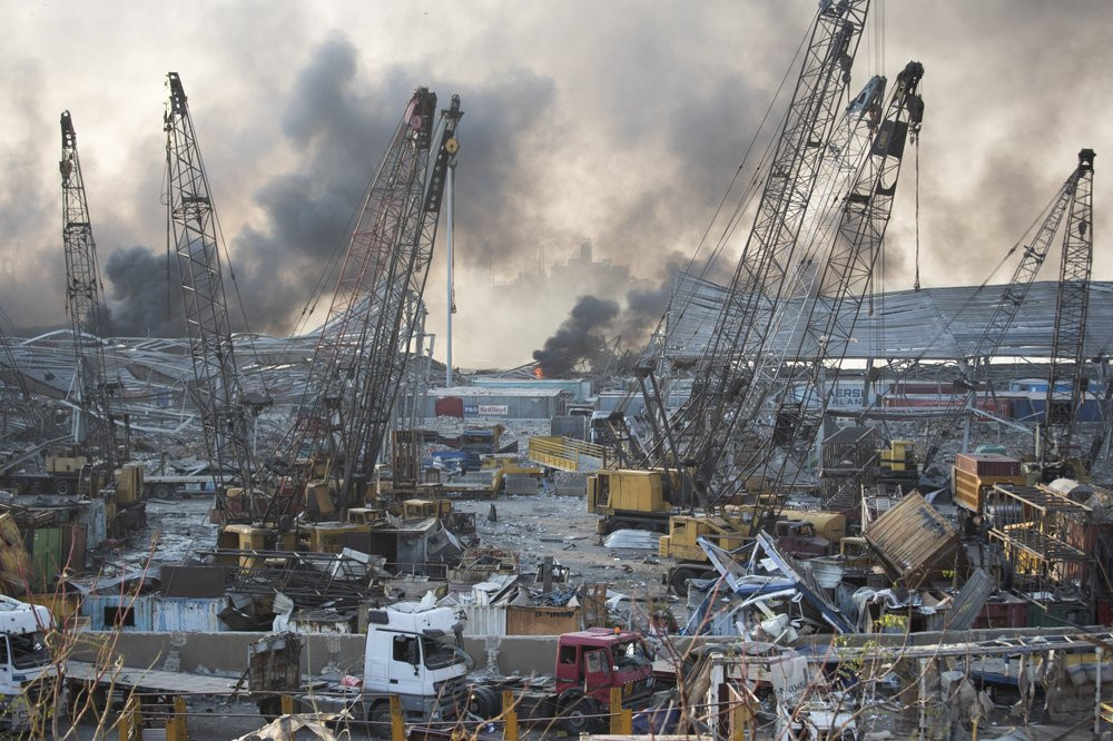Massive explosions rocked downtown Beirut on Tuesday, flattening much of the port, damaging buildings and blowing out windows and doors as a giant mushroom cloud rose above the capital.