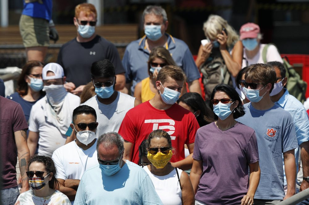 In this July 30, 2020, file photo, passengers board a Casco Bay Lines ferry bound for Peaks Island in Portland, Maine.