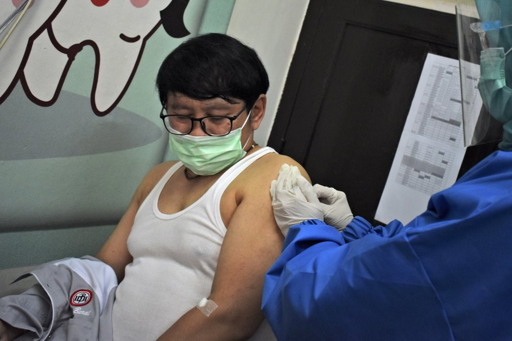 File photo of  a Chinese man being administered COVID-19 vaccine during trial.