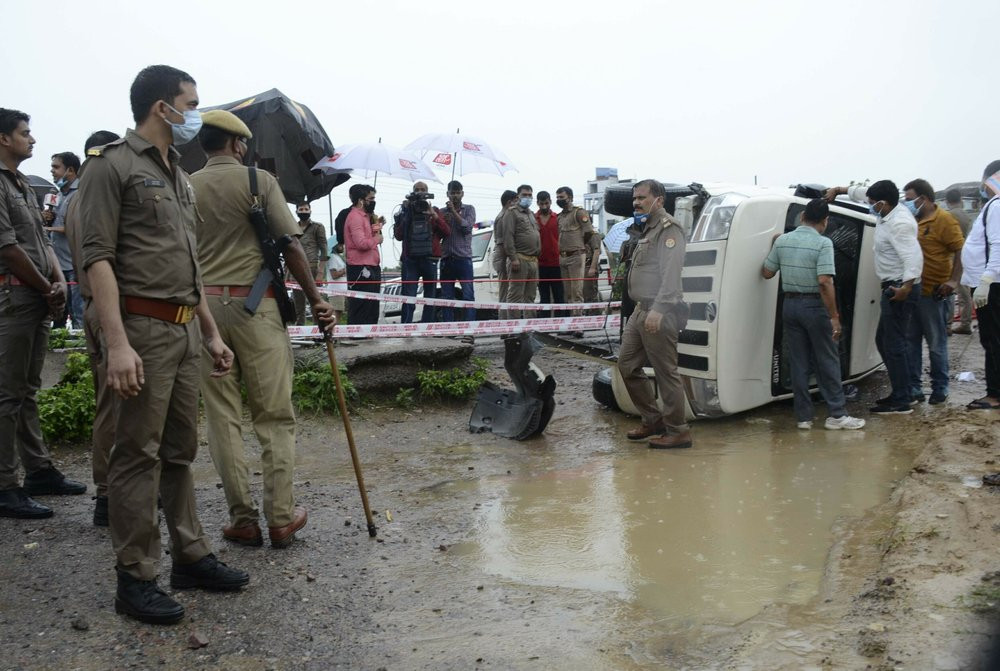 In this July 10, 2020, file photo, policemen cordon off the site where Vikas Dubey, a top crime suspect linked to the death of eight policemen was killed near Kanpur, India.