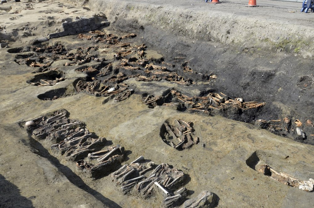 This undated photo provided Wednesday, Aug. 26, 2020, by Osaka City Cultural Properties Association shows human bones found at the north section of the "Umeda Grave" burial site in Osaka, wes