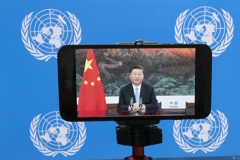 Chinese President Xi Jinping is seen on a video screen remotely addressing the 75th session of the United Nations General Assembly, Tuesday, Sept. 22, 2020, at U.N. headquarters.