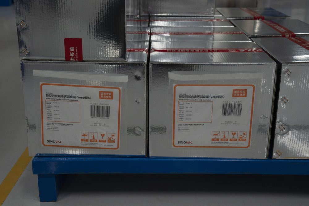 Boxes of SARS CoV-2 Vaccine for COVID-19 stamped with the words "State Authorized, Emergency Use" produced by SinoVac are stacked at its factory in Beijing on Thursday, Sept. 24, 2020.