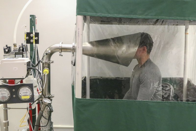 This February 2018 photo provided by the University of Maryland School of Public Health shows The Gesundheit II machine in Dr. Donald Milton's Public Health Aerobiology, Virology, and Exhaled