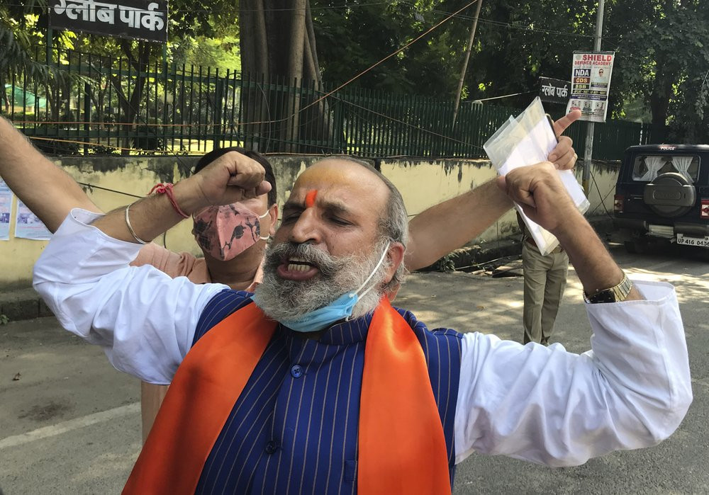 Jai Bhagwan Goyal, a leader of India's ruling Bharatiya Janata Party and an accused in the 1992 attack and demolition of a 16th century mosque, celebrates outside a court in Lucknow, India, W