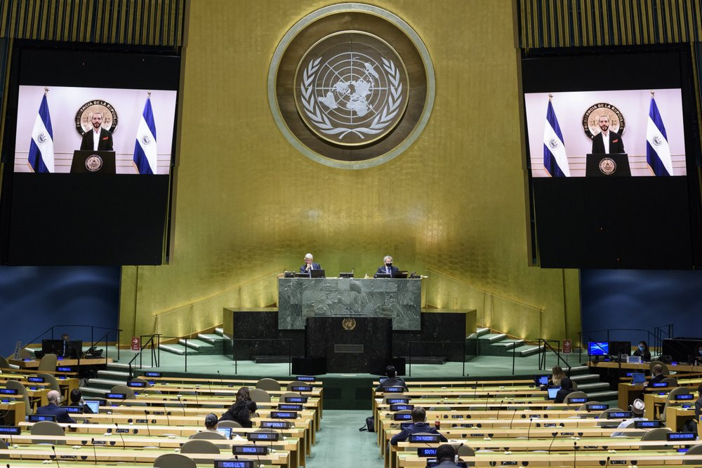 In this photo provided by the United Nations, Nayib Armando Bukele, president of El Salvador, is shown on video monitors as he speaks in a pre-recorded video message, during the 75th session 