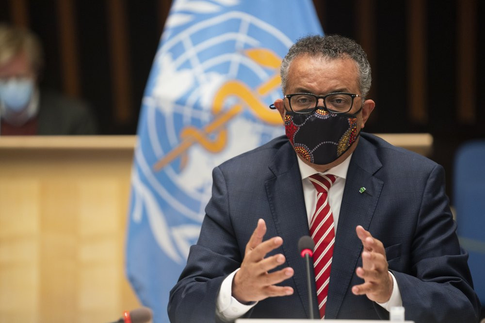 In this photo released by WHO on Monday, Oct. 5, 2020, WHO Director-General, Dr Tedros Adhanom Ghebreyesus, wearing a mask to protect against coronavirus, gestures during a special session on