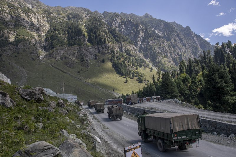 In this Sept. 9, 2020, file photo, an Indian army convoy moves on the Srinagar- Ladakh highway at Gagangeer, northeast of Srinagar, Indian-controlled Kashmir.