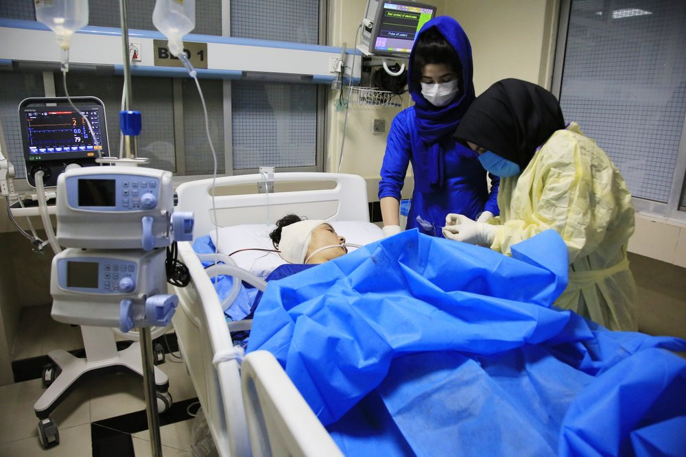 An Afghan receives treatment at hospital after suicide attack in Kabul, Afghanistan, Saturday, Oct. 24, 2020. The death toll from the suicide attack Saturday in Afghanistan's capital has rise