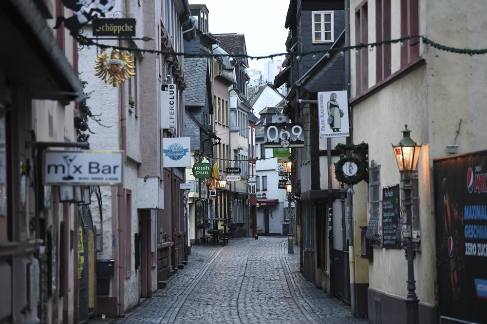 The Klappergasse in Frankfurt's pub district of Alt-Sachsenhausen is deserted in Frankfurt, Germany, Monday, Nov.2, 2020. A four-week partial lockdown has begun all over Germany to slow down 