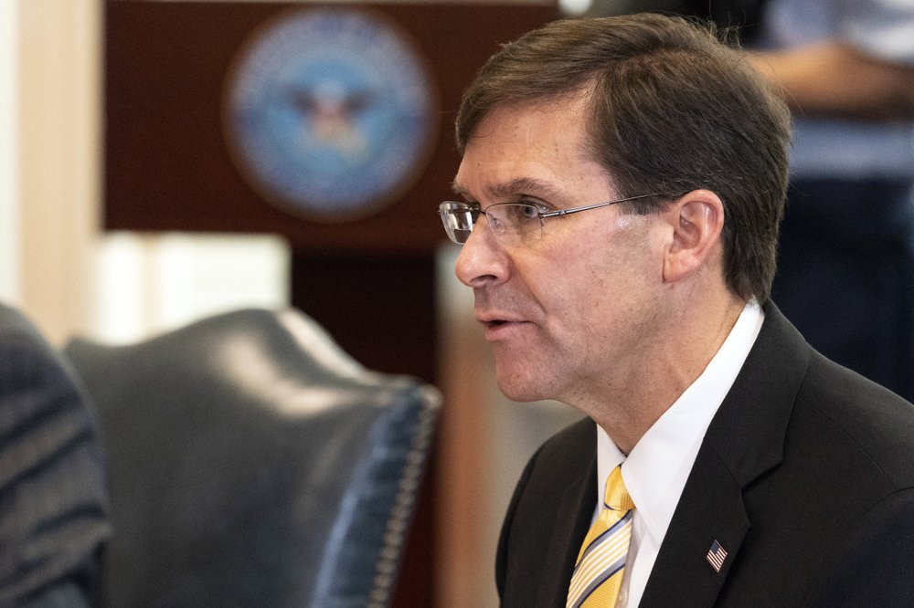 In this Oct. 8, 2020, file photo, Secretary of Defense Mark Esper speaks before a meeting with Romanian Defense Minister Nicolae Ciuca, at the Pentagon, in Washington. President Donald Trump 