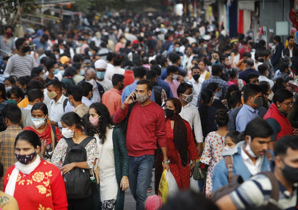 People throng a market to shop ahead of the Diwalli festival in New Delhi, India, Thursday, Nov. 12, 2020.