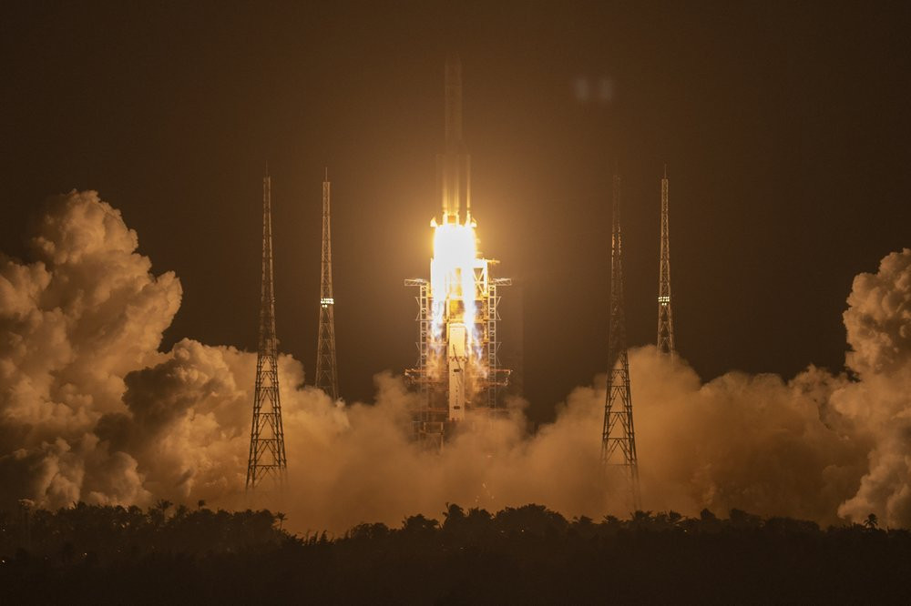 A Long March-5 rocket carrying the Chang'e 5 lunar mission lifts off at the Wenchang Space Launch Center in Wenchang in southern China's Hainan Province, early Tuesday, Nov. 24, 2020.