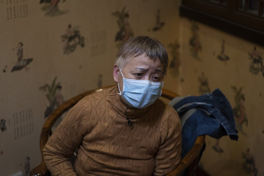 Zhong Hanneng talks about how her son, Peng Yi, had trouble getting tested for COVID-19 and eventually died from the disease, in Wuhan in central China's Hubei province on Saturday, Oct. 17, 