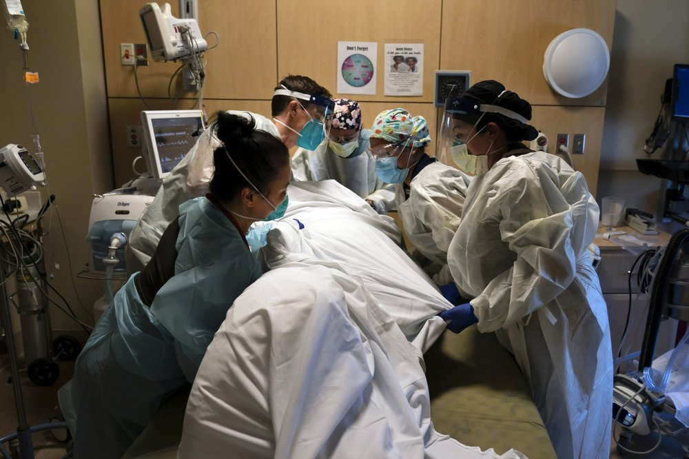In this Nov. 19, 2020, file photo, medical personnel prone a COVID-19 patient at Providence Holy Cross Medical Center in the Mission Hills section of Los Angeles.