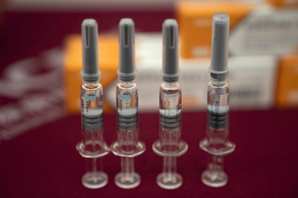 In this Sept. 24, 2020, file photo, syringes of SARS CoV-2 Vaccine for COVID-19 produced by Sinovac are displayed during a media tour of its factory in Beijing.