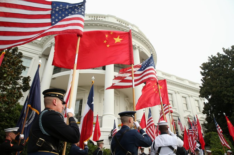 In this Sept. 25, 2015, file photo, a military honor guard await the arrival of Chinese President Xi Jinping for a state arrival ceremony at the White House in Washington.
