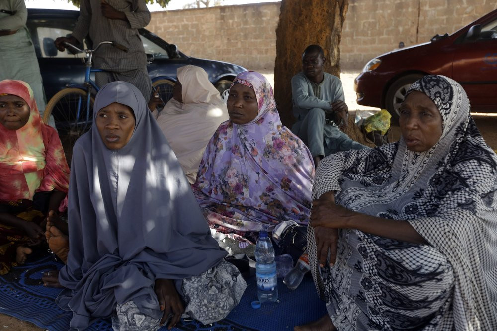Parents of the missing Government Science secondary school students wait for news on their children in Kankara , Nigeria, Tuesday, Dec. 15, 2020.