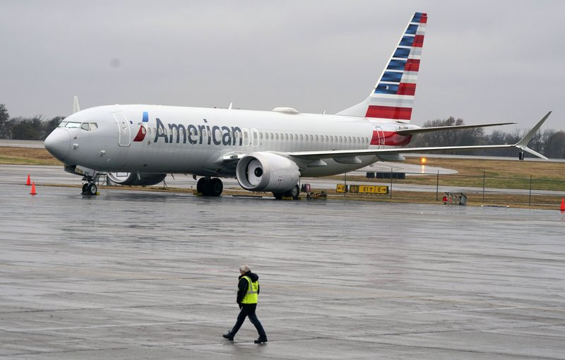 In this Dec. 2, 2020 file photo, an American Airlines Boeing 737 Max jet plane is parked at a maintenance facility in Tulsa, Oklahoma.