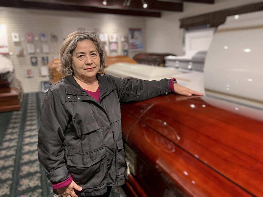 Magda Maldonado, owner of Continental Funeral Home in Los Angeles, poses in her mortuary on Dec. 30, 2020.