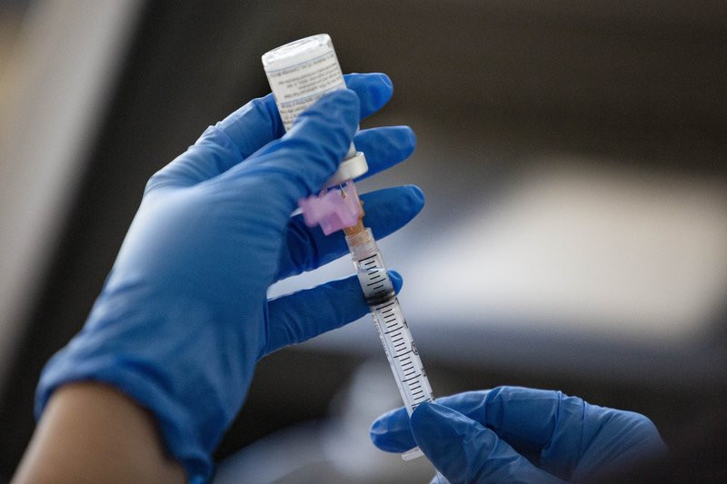 RN Connie Garcia extracts a dose of the Moderna Covid-19 vaccine which will be administered to a Texas Tech University Health Science Center student at Texas Tech University Health Science Ce