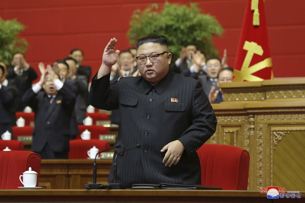 In this photo provided by the North Korean government, North Korean leader Kim Jong Un acknowledges to the applauds after he made his closing remarks at a ruling party congress in Pyongyang, 