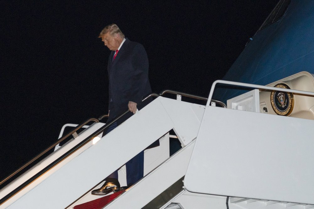 US President Donald Trump steps off Air Force One upon arrival, Tuesday, Jan. 12, 2021, at Andrews Air Force Base, Maryland.