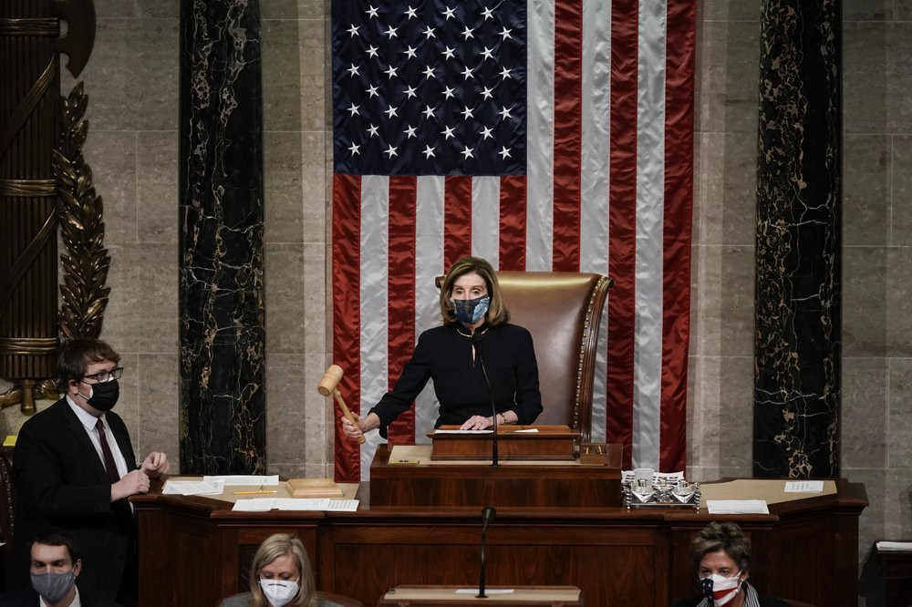 Speaker of the House Nancy Pelosi, D-Calif., leads the final vote of the impeachment of President Donald Trump, for his role in inciting an angry mob to storm the Congress last week, at the C