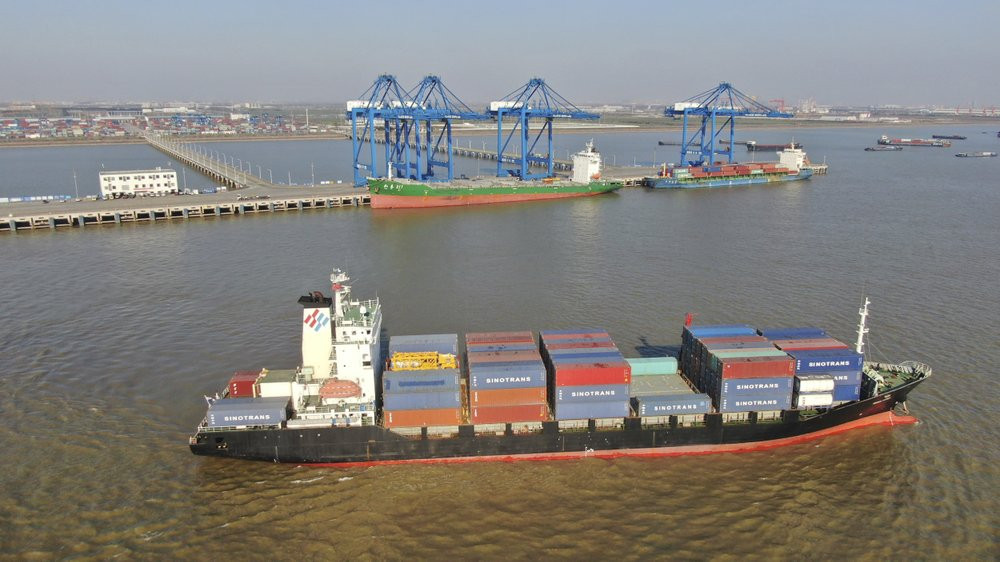 A container ship leaves a port in Nantong in eastern China's Jiangsu Province, Dec. 20, 2020.
