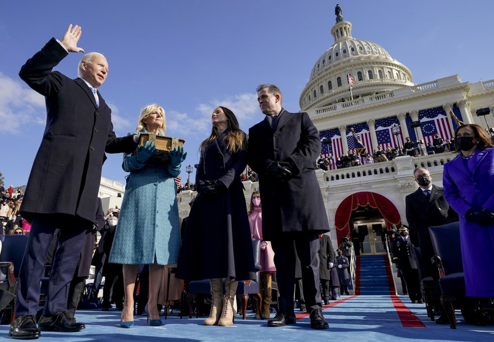 Joe Biden is sworn in as the 46th president of the United States by Chief Justice John Roberts as Jill Biden holds the Bible during the 59th Presidential Inauguration at the U.S. Capitol in W