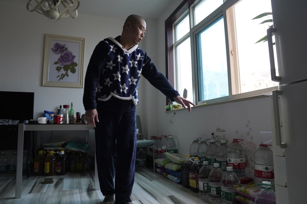Wuhan resident Zhu Tao talks about his stockpile of supplies at home in Wuhan in central China's Hubei province on Wednesday, Oct. 21, 2020.