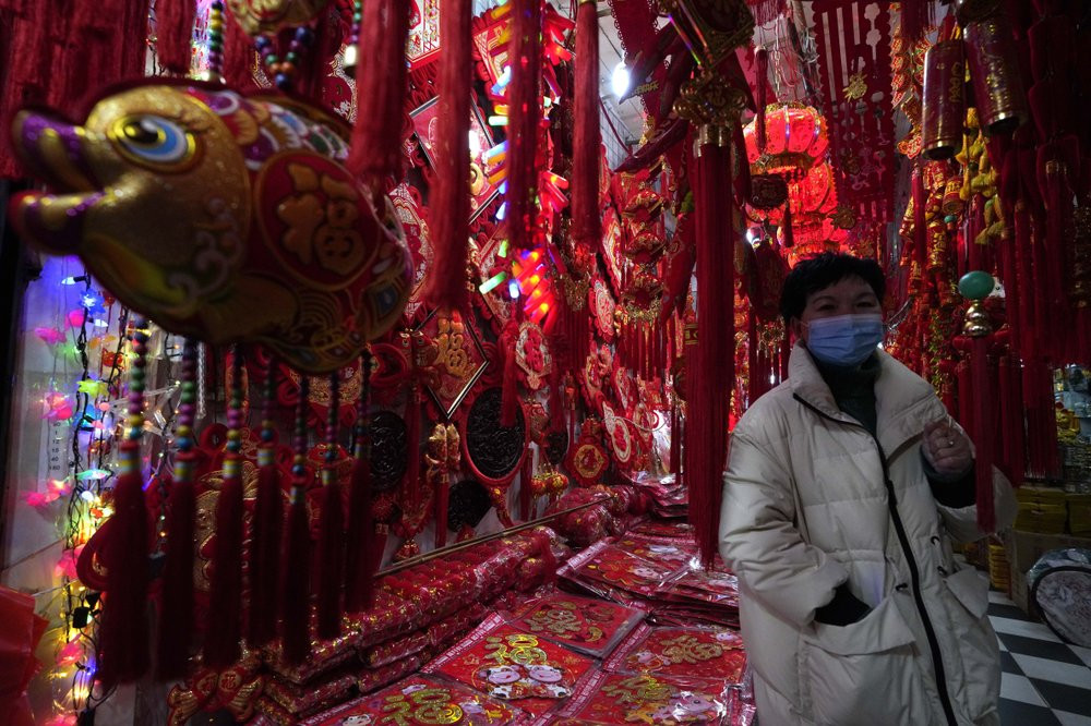 Gong Linhua, a seller of Lunar New Year decorations, speaks about the impact of the coronavirus on her business ahead of the Year of the Ox Chinese Lunar New Year celebrations in Wuhan in cen