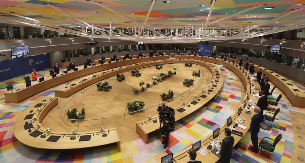 In this Thursday, Dec. 10, 2020 file photo, European Union leaders stand during a round table meeting at an EU summit in Brussels.