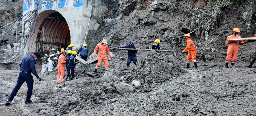 This photograph provided by National Disaster Response Force shows NDRF personnel prepare to rescue workers at one of the hydropower project at Reni village in Chamoli district of Indian stat