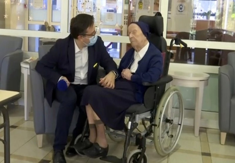In this image made from BFM TV video, Sister Andre, born Lucile Randon, is interviewed by David Tavella, Communications Manager for the Sainte Catherine Laboure Nursing Home in Toulon, France