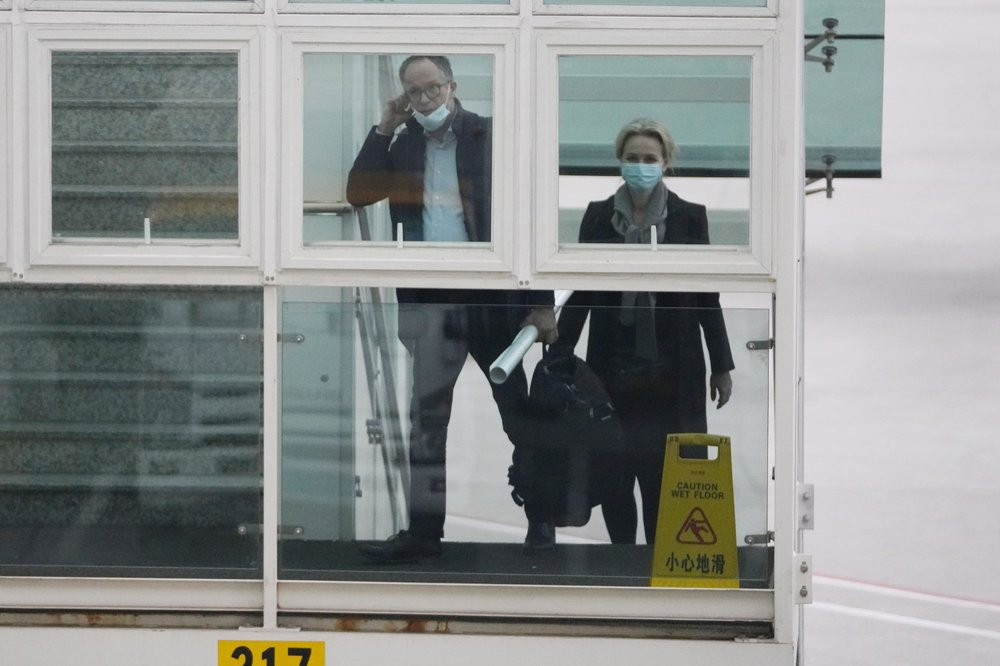 Peter Ben Embarek and Thea Koelsen Fischer of the World Health Organization team prepares to board a plane from the tarmac at the airport to leave at the end of the WHO mission in Wuhan, Chin
