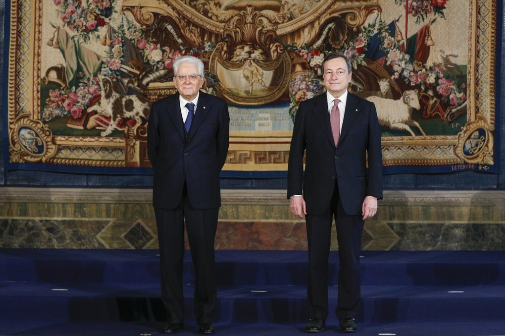Italian President Sergio Mattarella, left, and Premier Mario Draghi pose after the swearing-in ceremony, at the Quirinale Presidential Palace in Rome, Saturday, Feb. 13, 2021.
