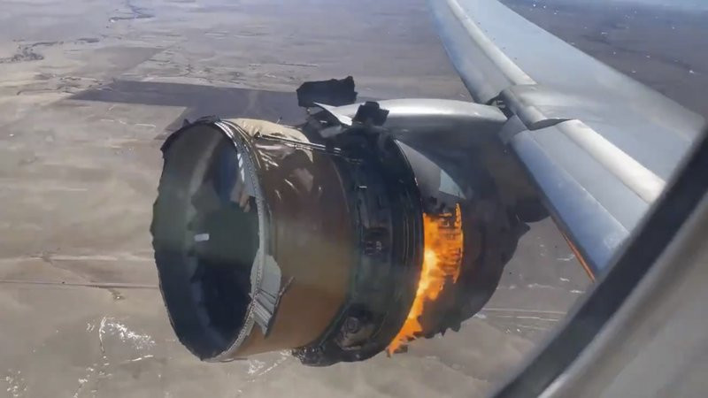 In this image taken from video, the engine of United Airlines Flight 328 is on fire after after experiencing "a right-engine failure" shortly after takeoff from Denver International Airport, 
