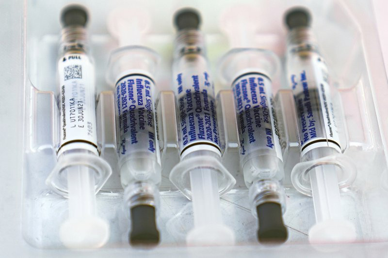 This Saturday, Oct. 17, 2020 file photo shows influenza vaccine syringes at the L.A. Care Health Plan and Blue Shield of California Promise Health Plan's Community Resource Center's Free Driv
