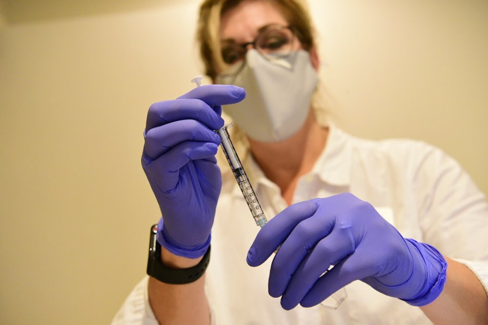 This September 2020, file photo provided by Johnson & Johnson shows a pharmacist preparing to give an experimental COVID-19 vaccine.