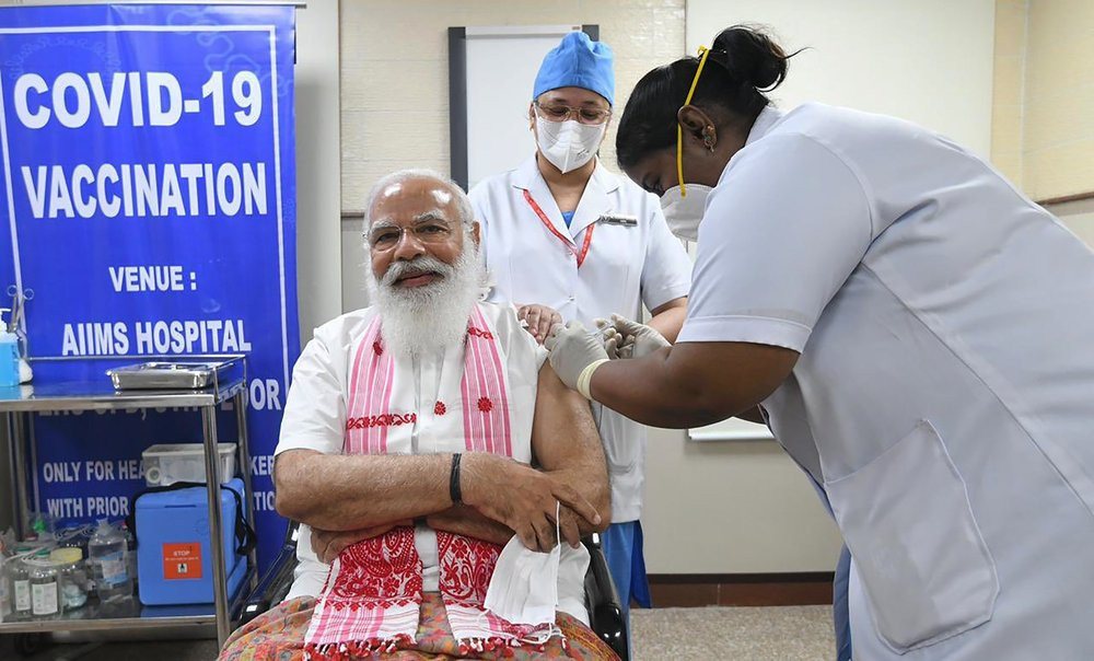In this photo provided by Prime Minister of India Narendra Modi's twitter handle, Indian Prime Minister Narendra Modi is administered a COVID-19 vaccine in New Delhi, India, Monday, March 1, 