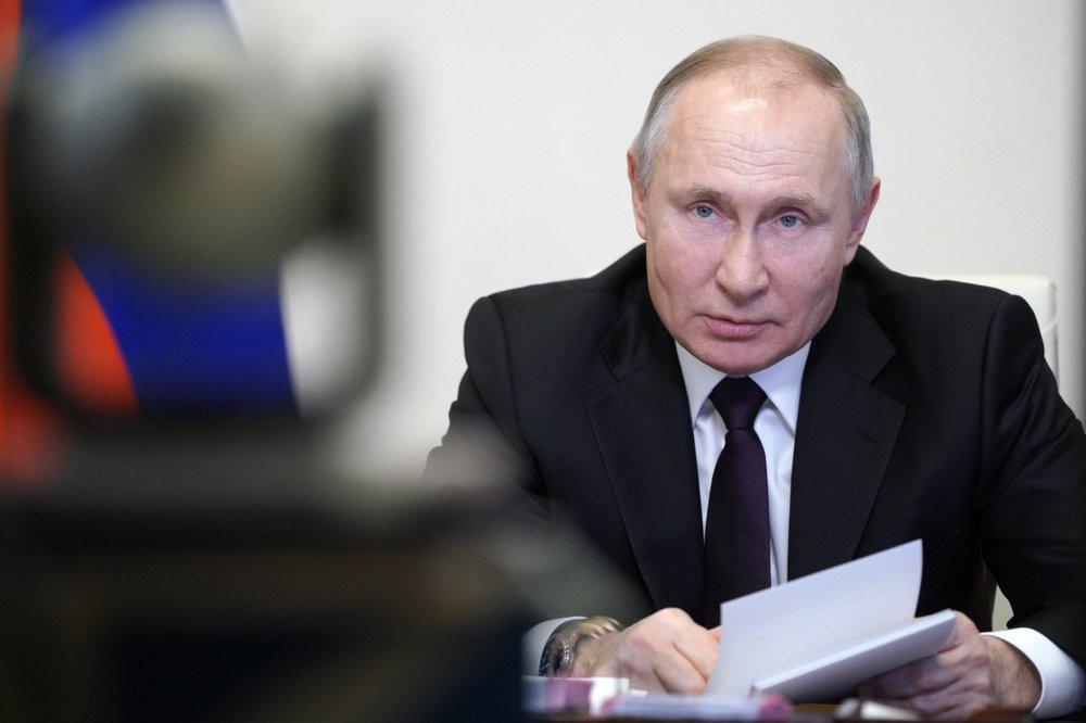In this March 11, 2021, file photo, Russian President Vladimir Putin speaks during a meeting via video conference with officials and government cabinet members in Moscow, Russia.