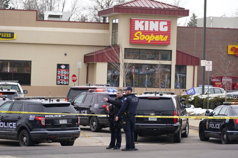 Police work on the scene outside of a King Soopers grocery store where a shooting took place Monday, March 22, 2021, in Boulder, Colorado.